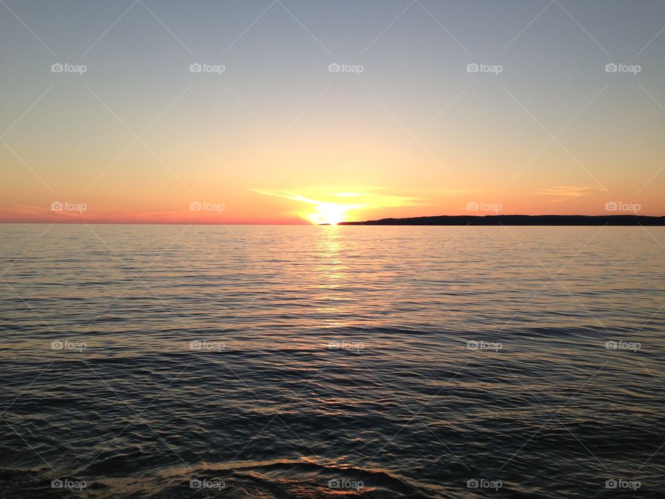 Horizontal . The sun and more of the lake in Michigan's UP