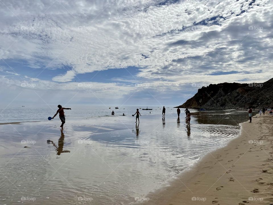 People playing on the beach