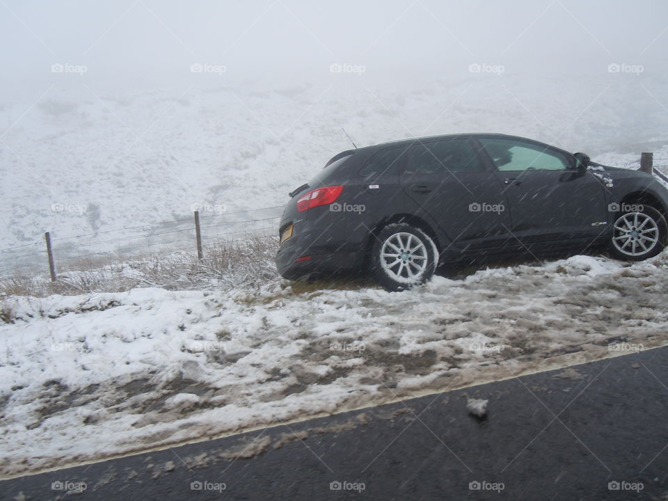 Snake pass black ice. One of the many vehicles that slid off the road on black ice