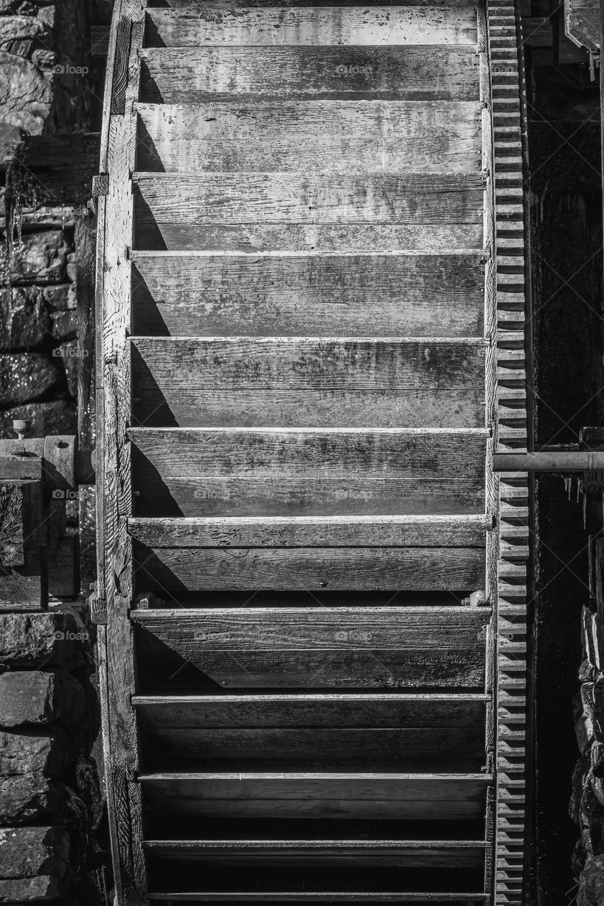 A gradient of water pockets of an old gristmill wheel. Historic Yates Mill County Park, Raleigh, North Carolina. 