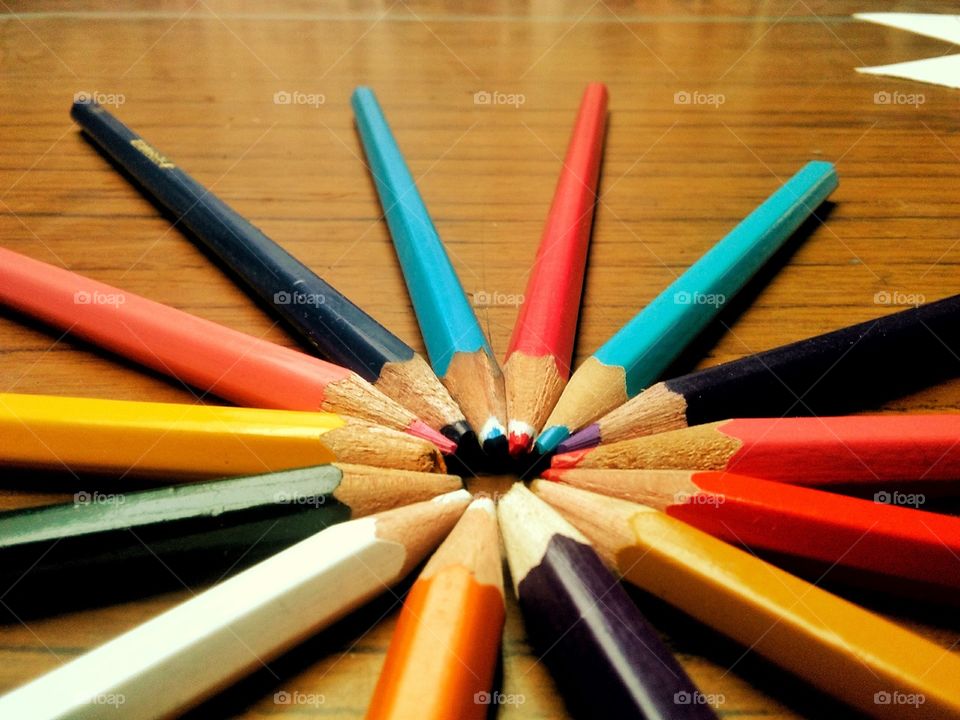 Colourful pencils arranged In circle
