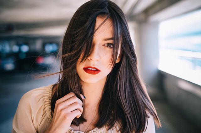 Portrait of a young woman with red lipstick