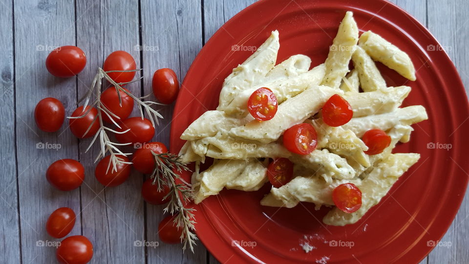 Pasta penne with tomatoes in plate