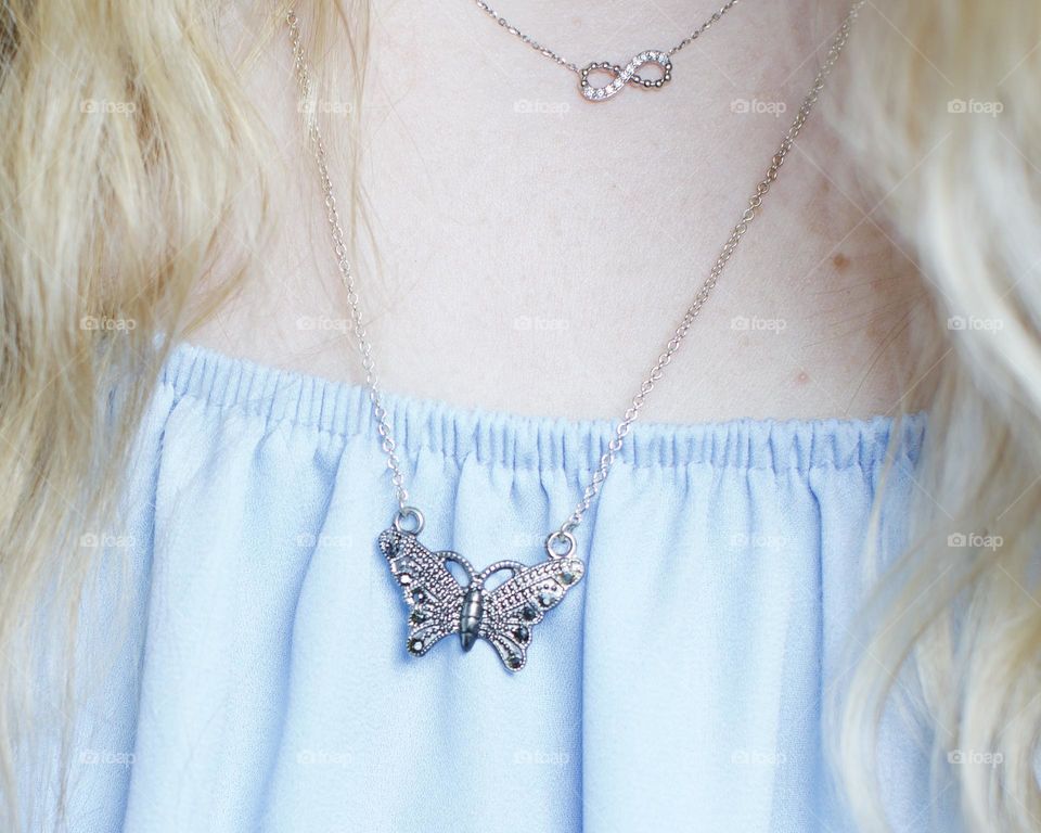 Butterfly necklace to adorn a baby blue dress