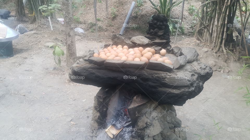 Manufacturing boiled egg on antique stone toaster