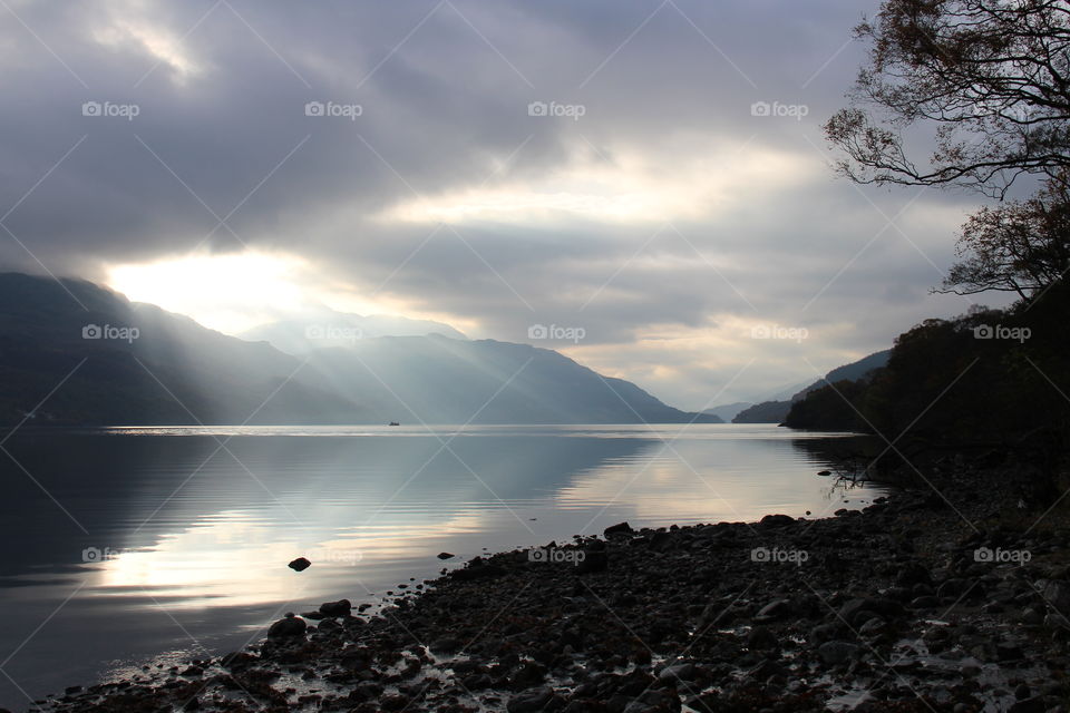 Reflection and sunbeams in beautiful Loch Lomond