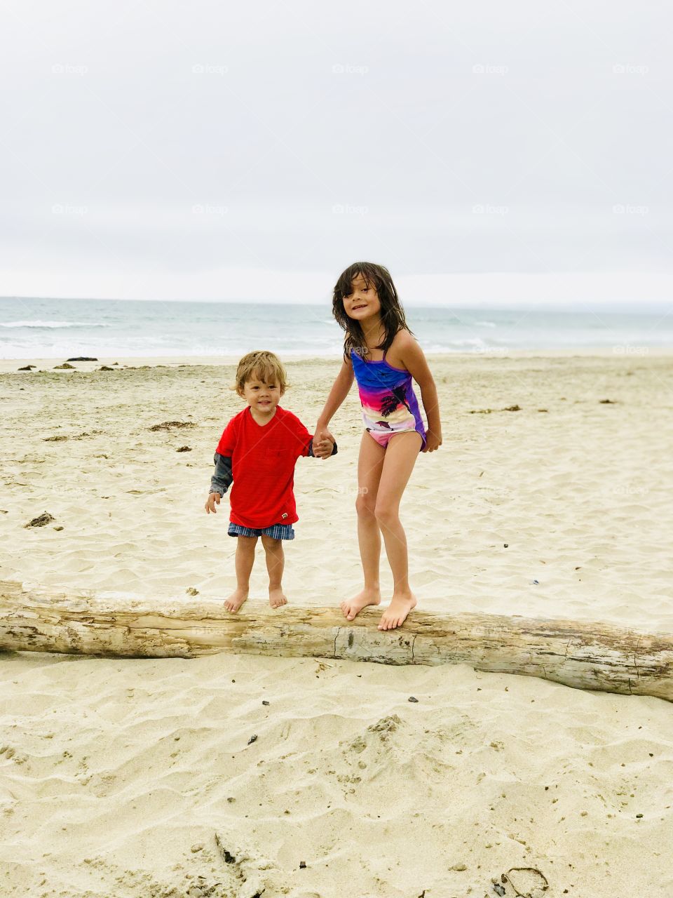 Awesome memories! on a log with little brother 