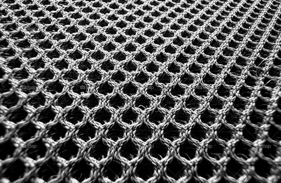 Black and white monochrome close up abstract futuristic mesh shape surface background