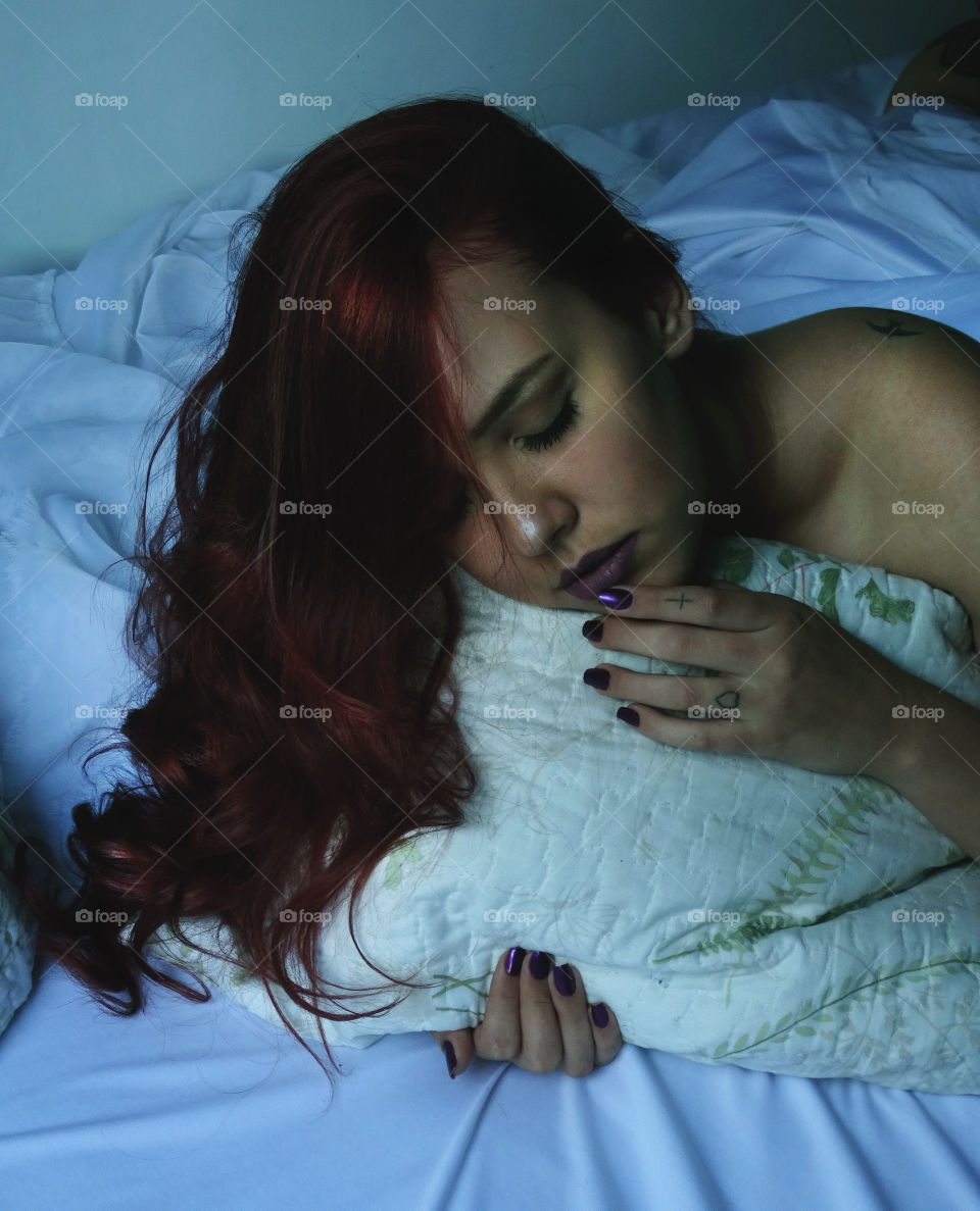 Woman sleeping on bed