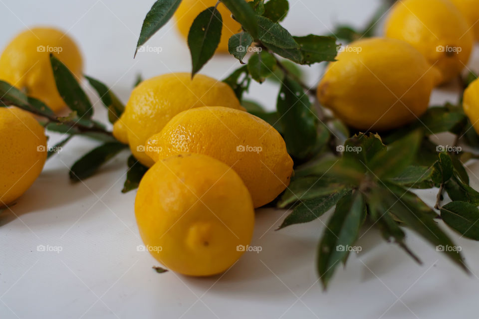 yellow lemons in a vase