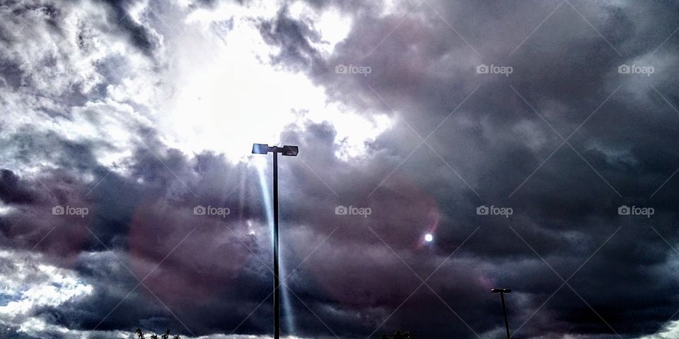 sun beam from gray clouds