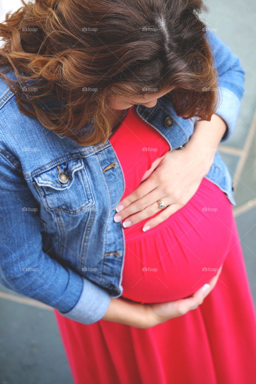 As she looked down at her baby belly, mommy whispered to her baby about all the wonderful things they would experience together. 