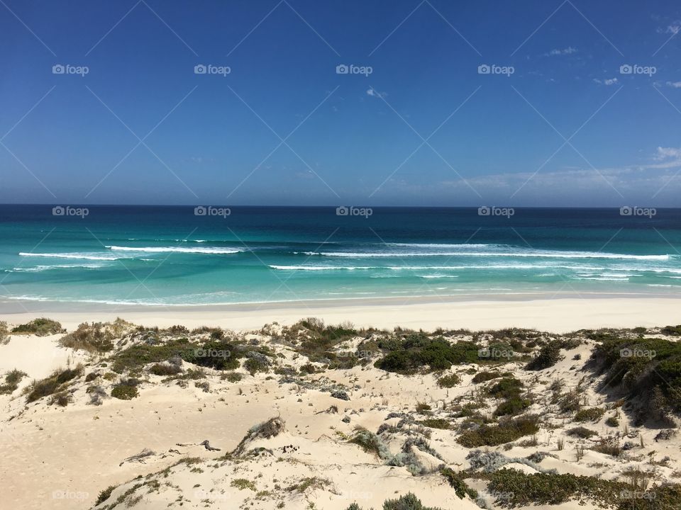 Turquoise blue ocean in south Australia with pristine remote beach and surf 