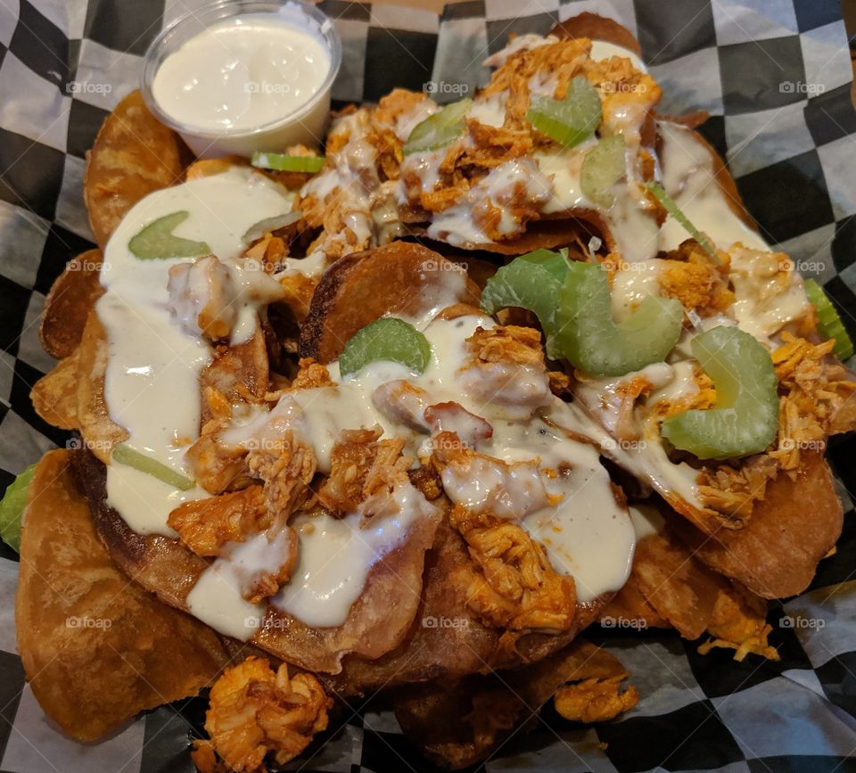 Chicken Nachos with celery and blue cheese