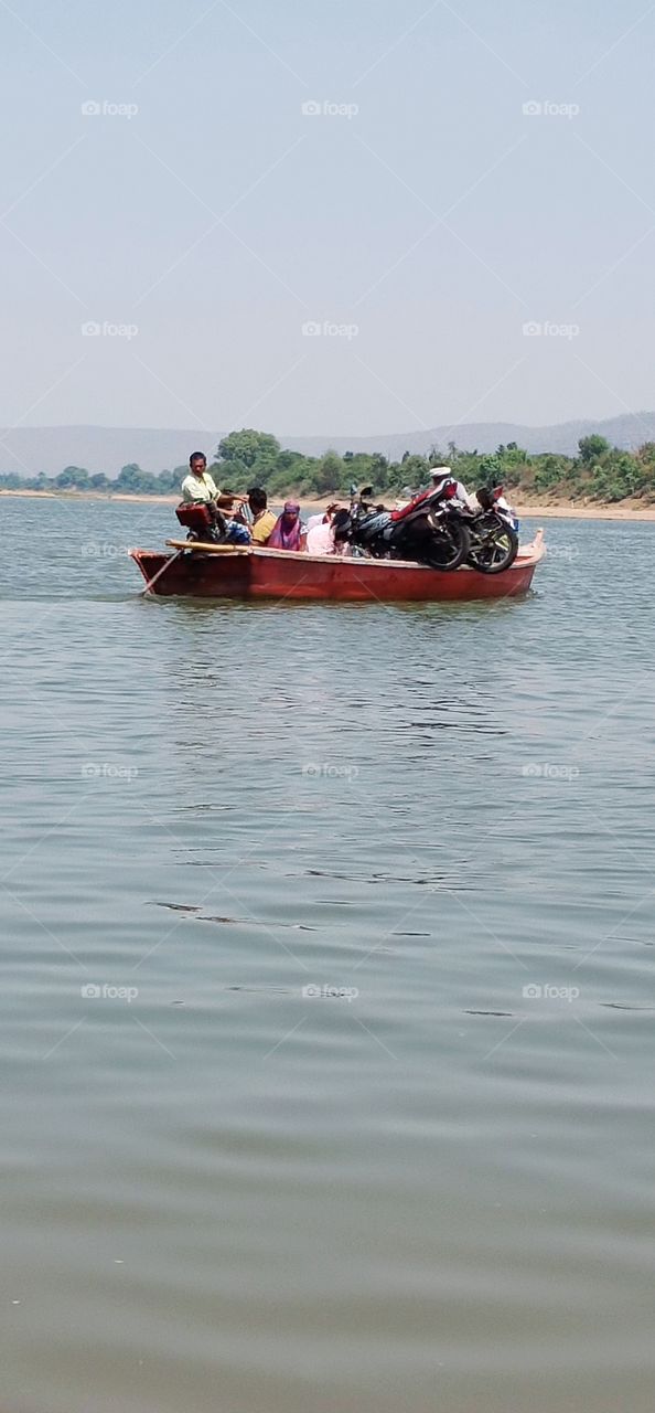 river & boat // people