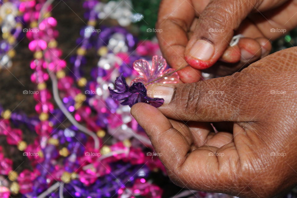 Multi colored bead in human hand