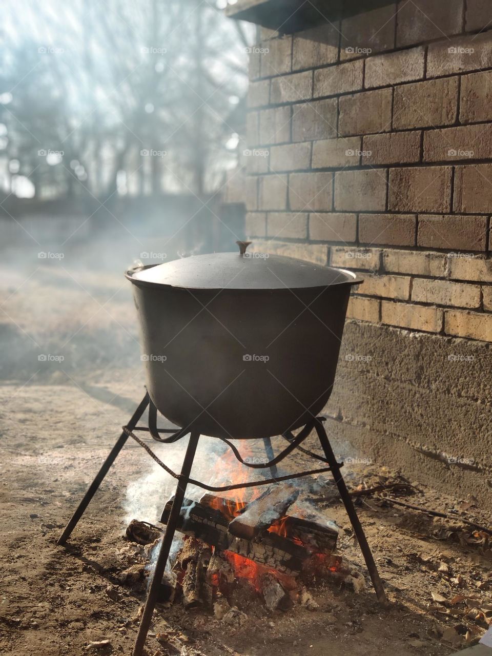 A pot on fire on the background of the wall