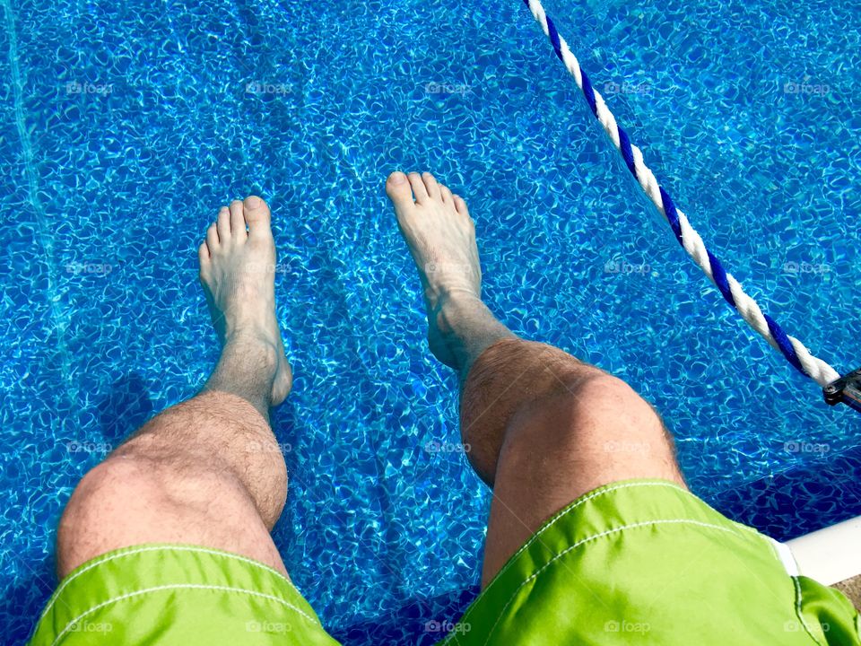 Man legs in the pool