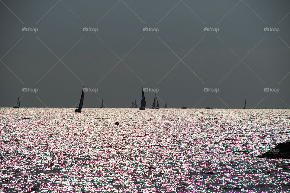 ships sailing at sunset over the Mediterranean