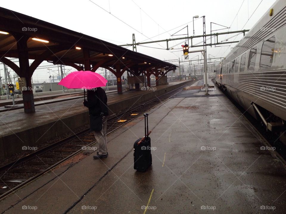 Man with pink umbrella