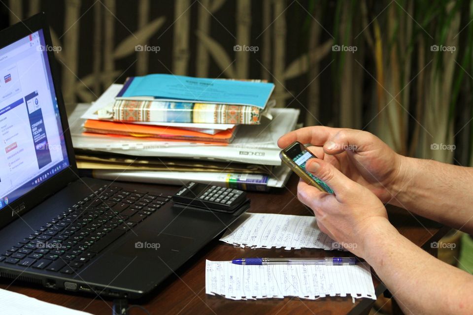 Using mobile phone and laptop