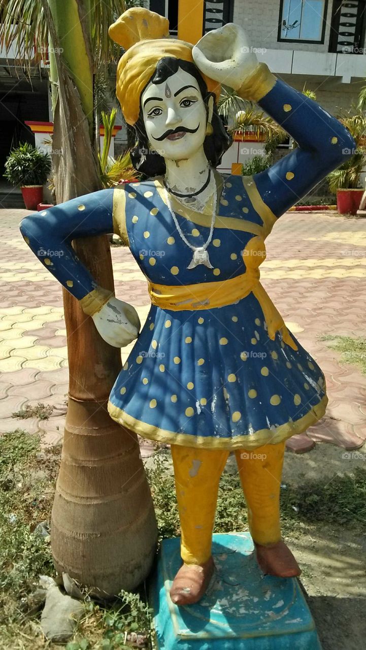 Sculpture of an man in  Rajasthani  Indian traditional costumes.