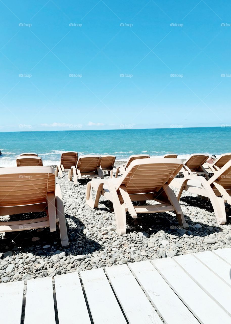 A feeling of peace and tranquility when you lie on a beach chaise longue