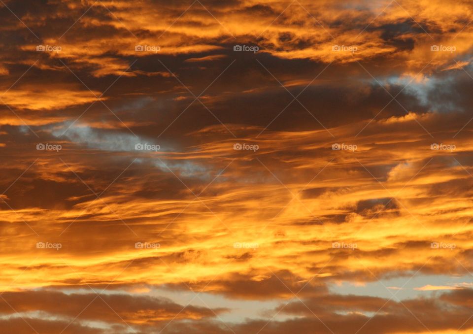 early morning Sunrise setting the clouds on fire.