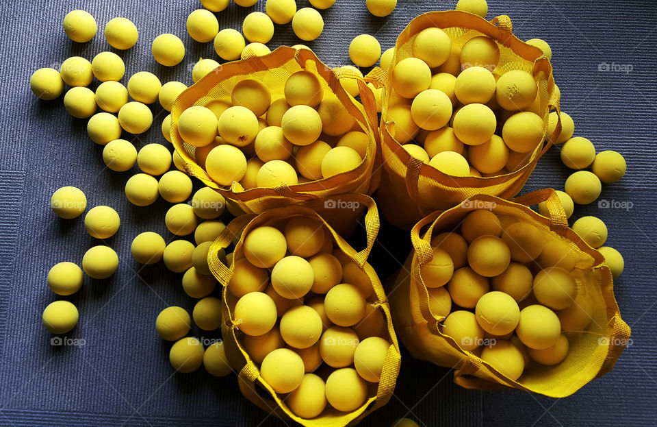 Bags of yellow balls