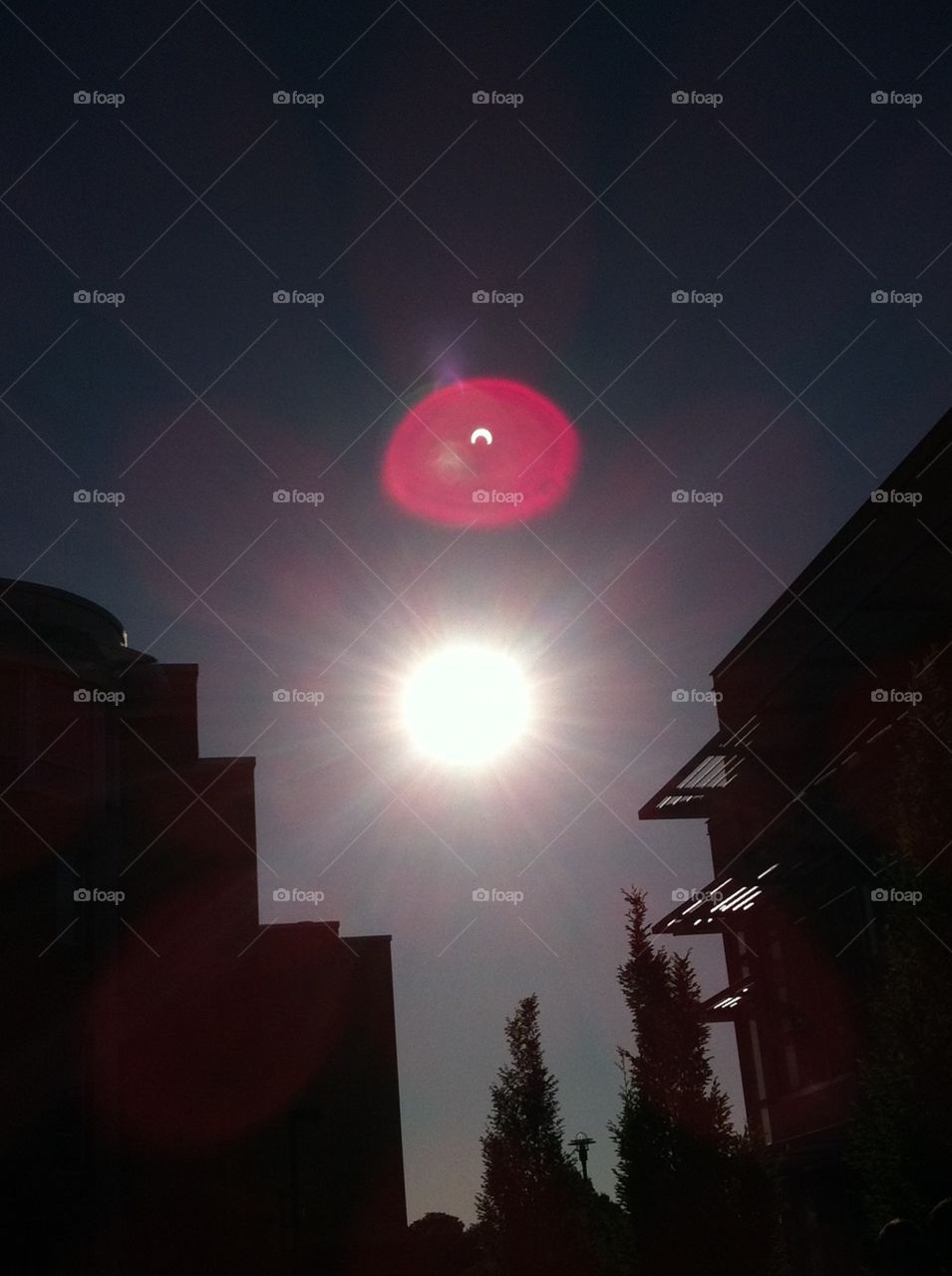 Over-the-shoulder view of a solar eclipse