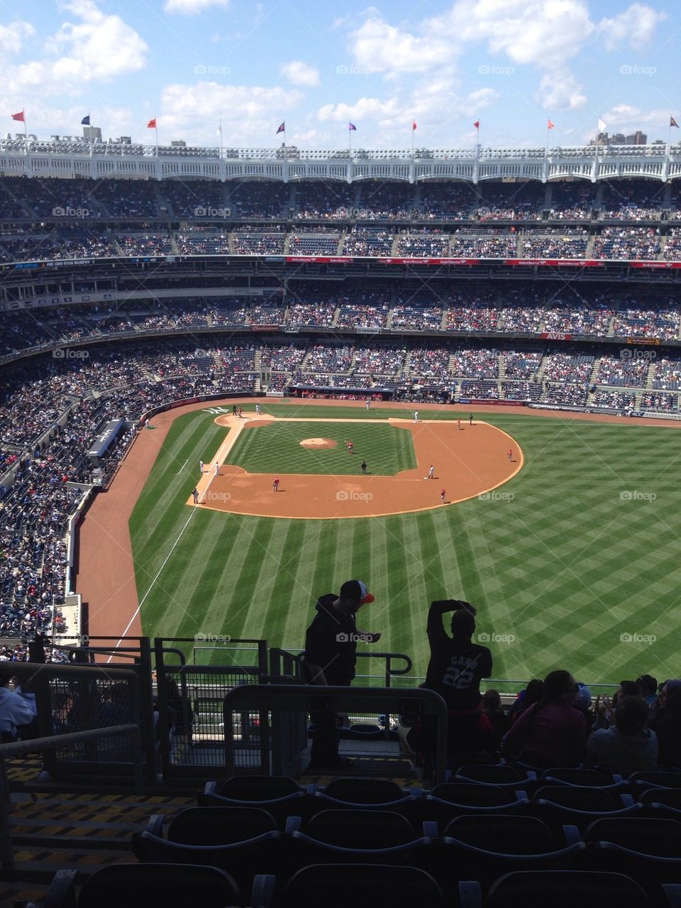 Take me out to the ballgame. A Yankees game in the nosebleeds.