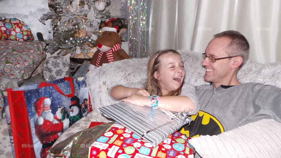 laughing with Christmas gifts