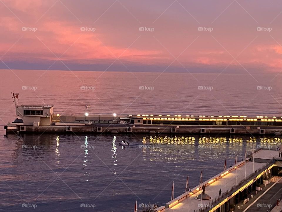 Lights of harbor at beginning of night 