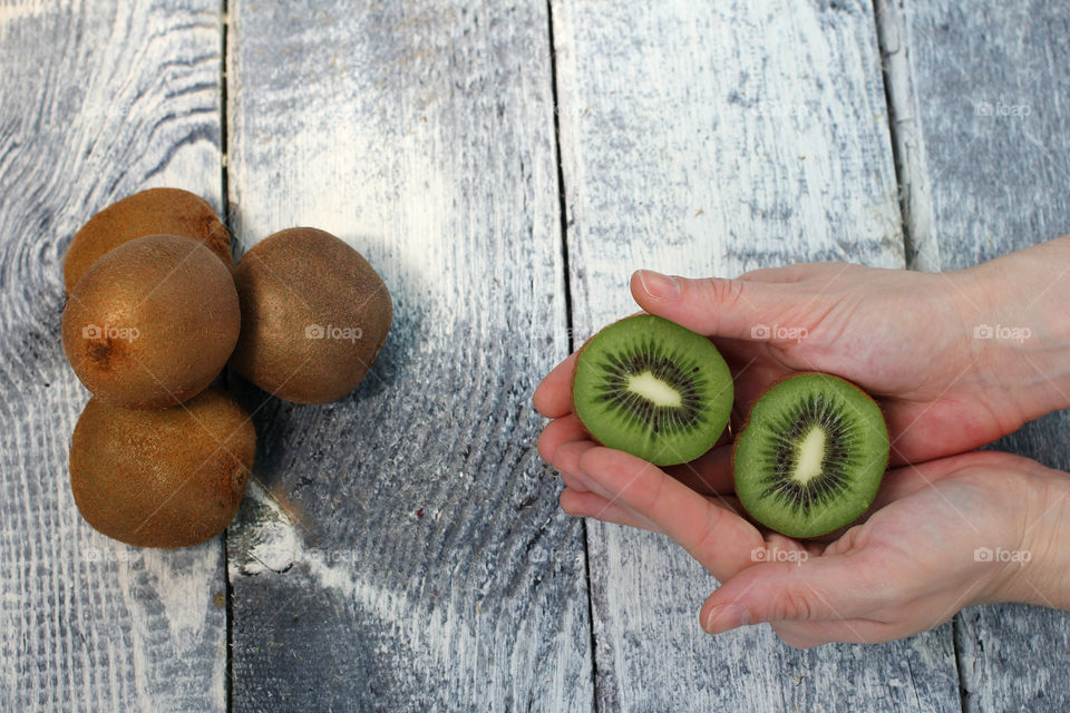 Hands, female hands, kiwi in hands, kiwi fruit, still life, abstraction