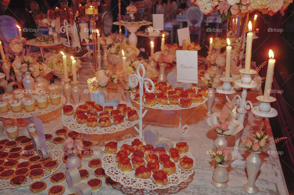 Banquet table decorated candles dessert