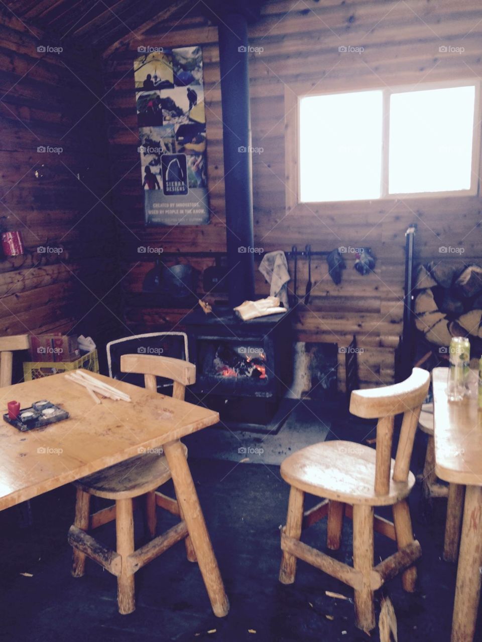 Inside log cabin with fireplace