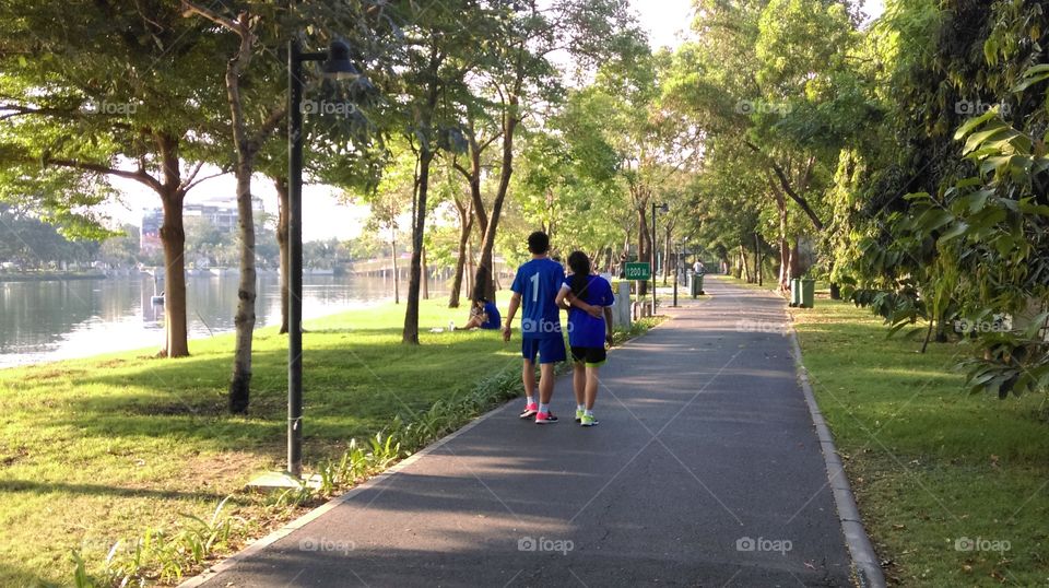 After hard running the couple do relax walking.