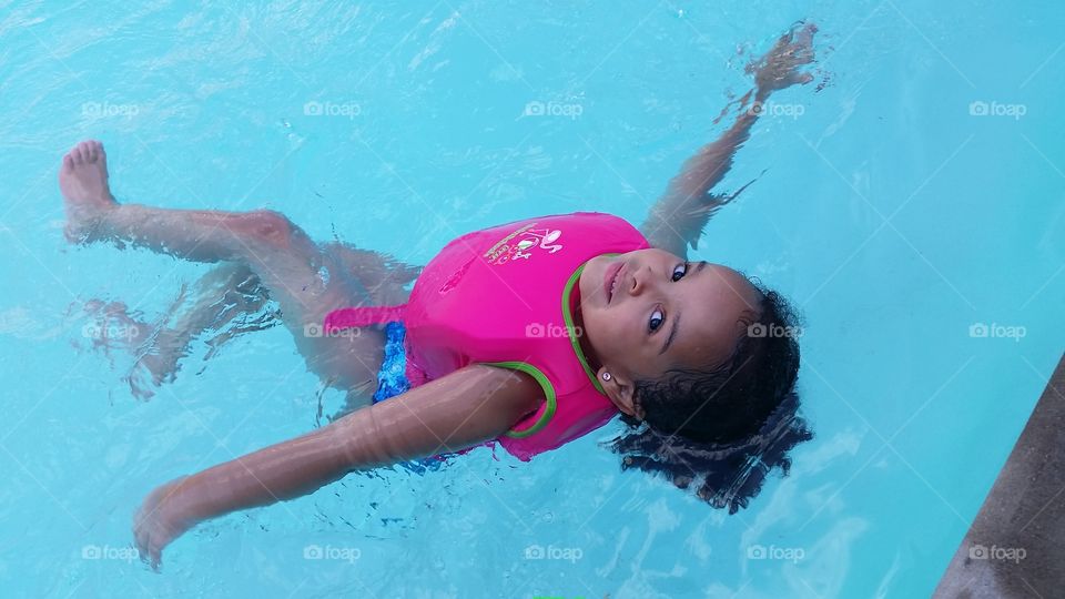 Elevated view of a girl in swimming pool