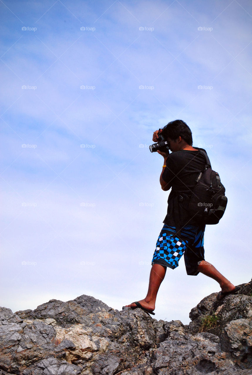 photographer on a rock