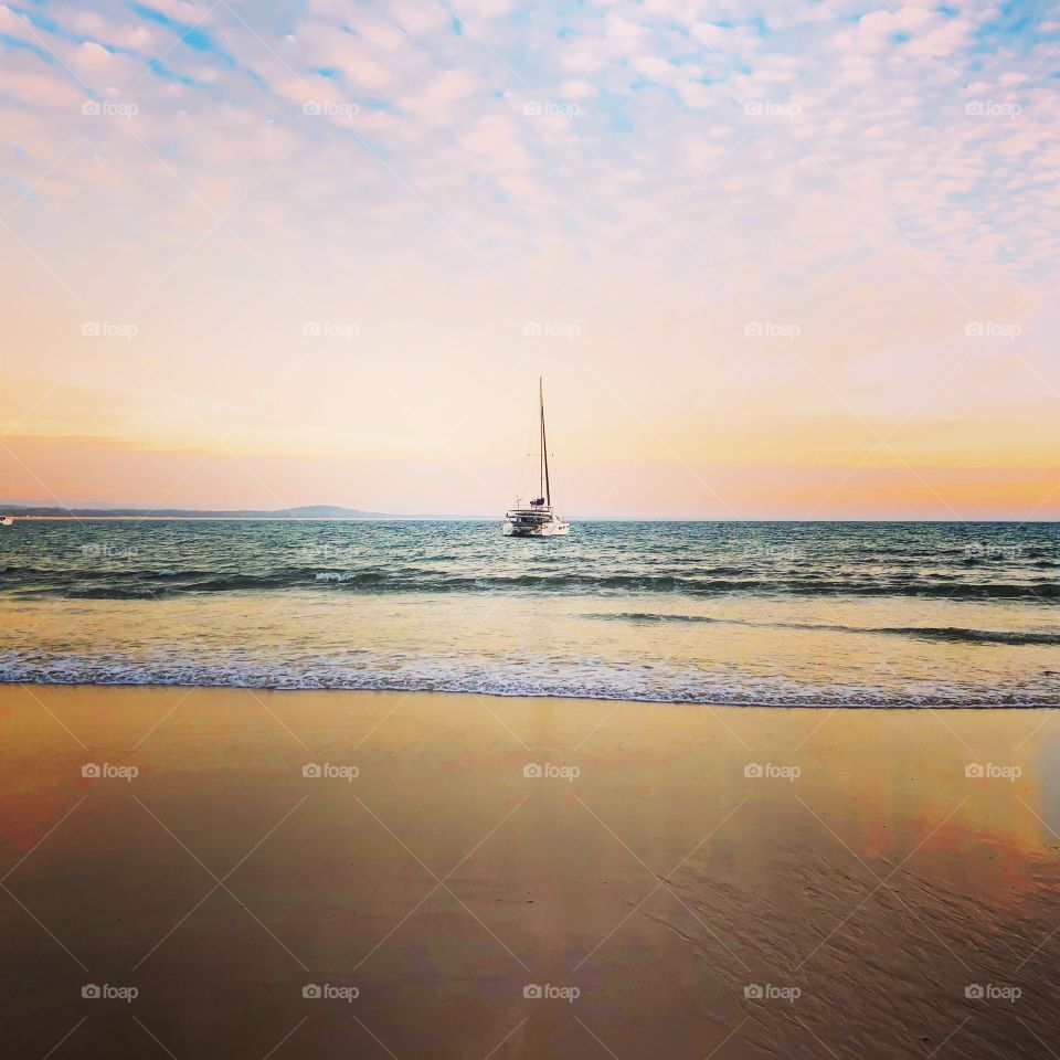 Yacht in the bay at sunrise 