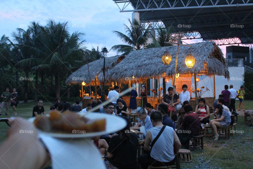Local vegetarian snacks and insightful chats during a pre-show time of cultural and historical Tonkin village in Vietnam. 