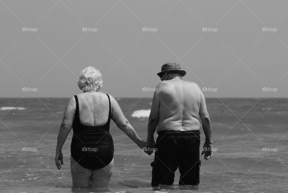 What a wonderful photo opportunity. I ran back to shore to grab my camera and capture this lovely couple. Edisto Beach in South Carolina was made more beautiful this day when I shot this sweet photo.