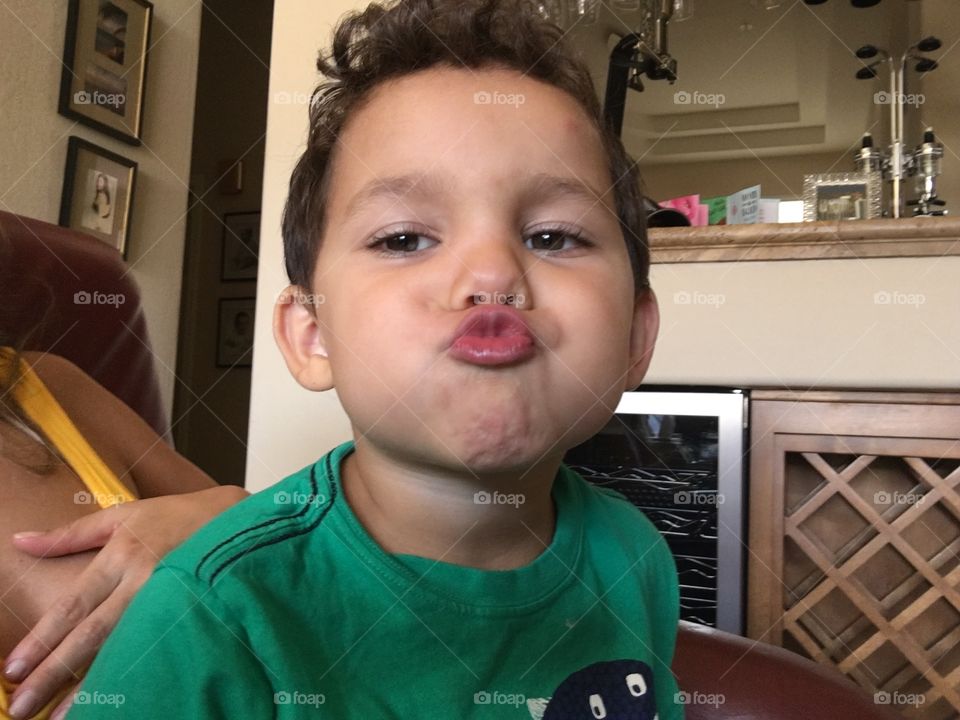 Boy making a duck face.