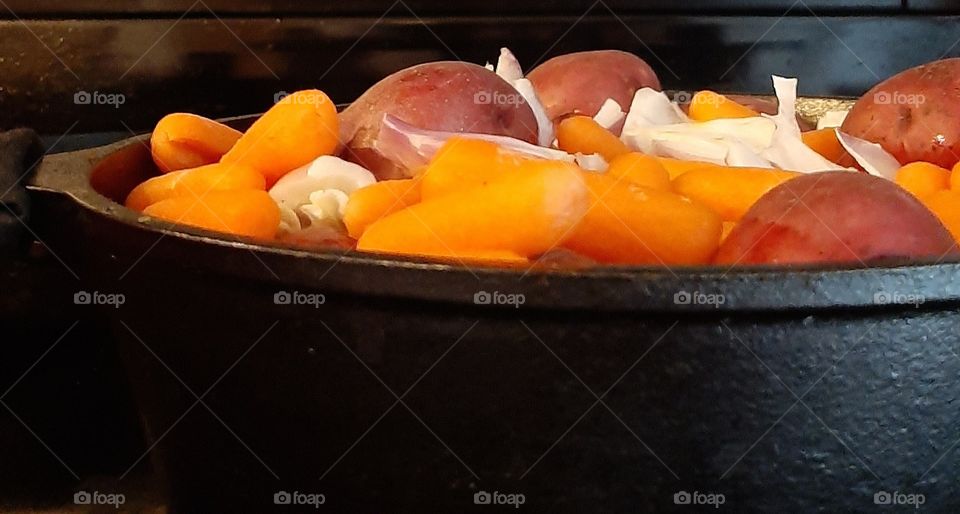 whats for dinner? new red potatoes purple onion baby carrots layered over pot roast slow cooked with garlic and Lawreys seasoning salt