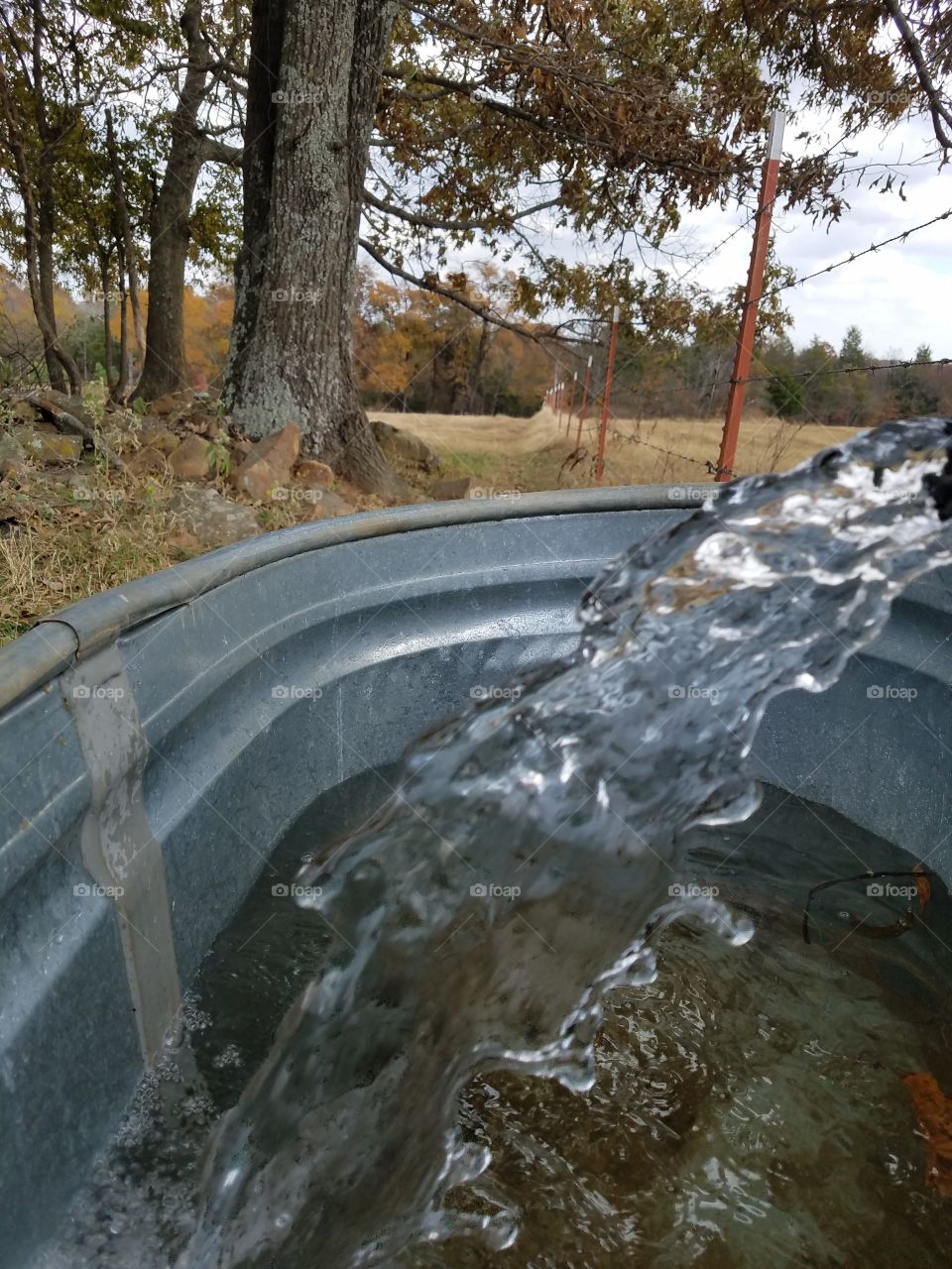water flowing in barrel