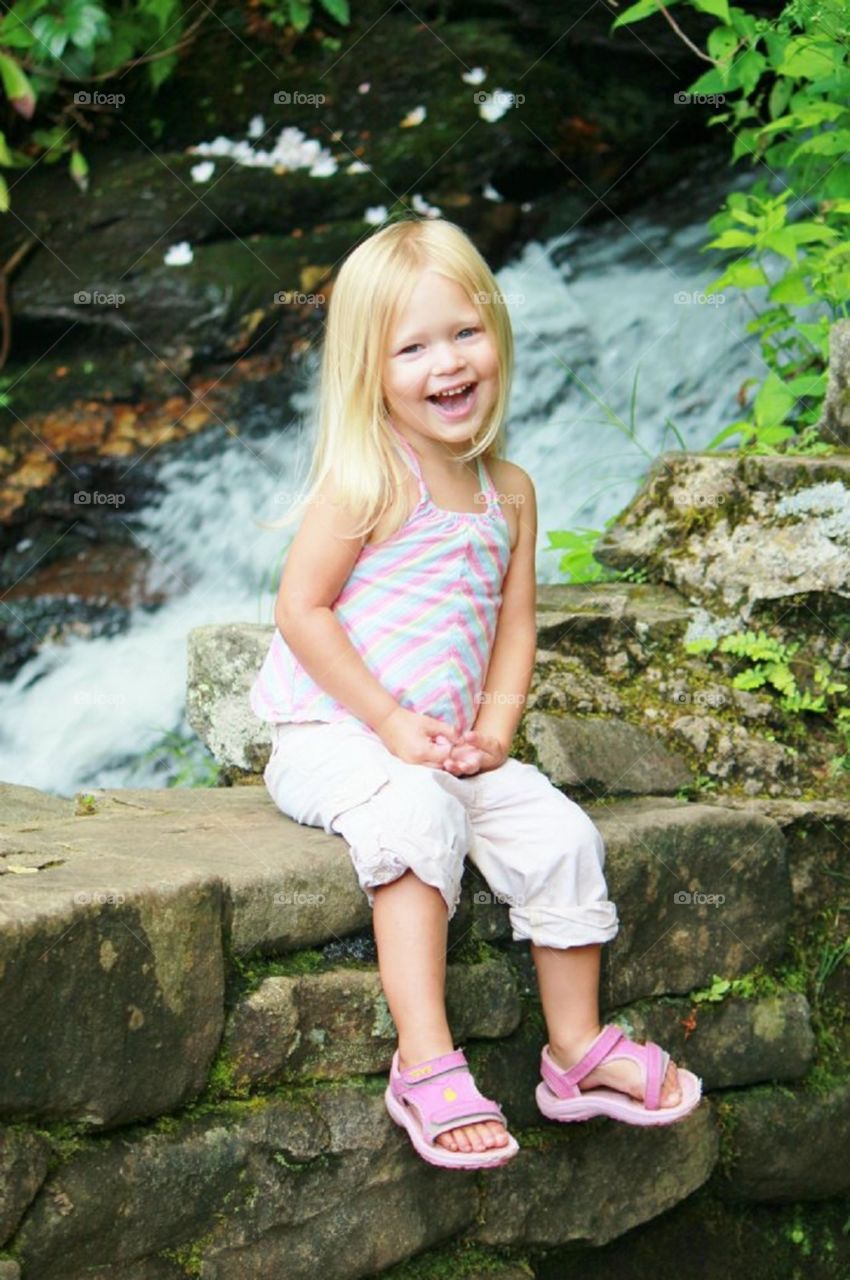 Daughter at a waterfall