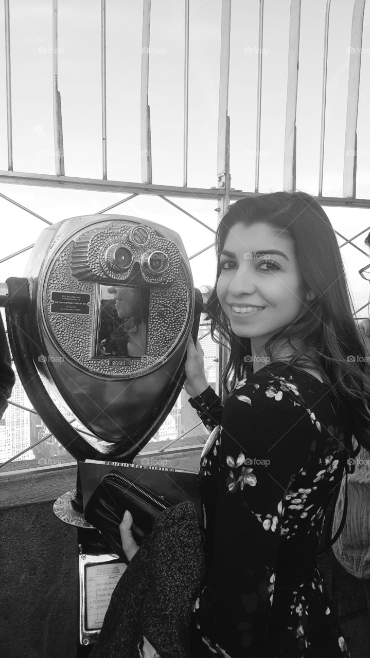 enjoying the view on top floor of empire state building