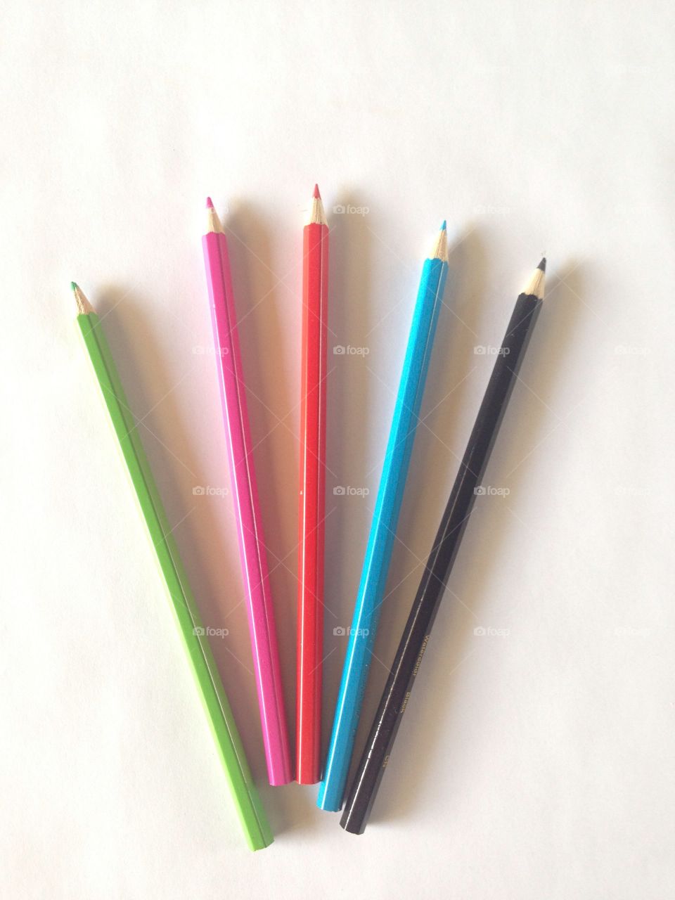 Colored pencils on a white background. Art and craft supplies photo. Back-to-school stock image.
