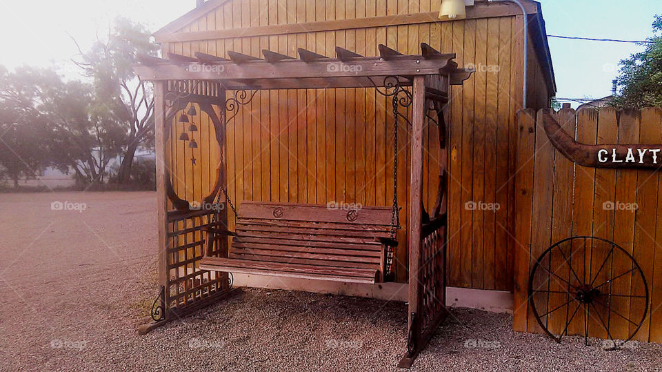 swing away. this old swing was rebuilt and sits in front of a restaraunt