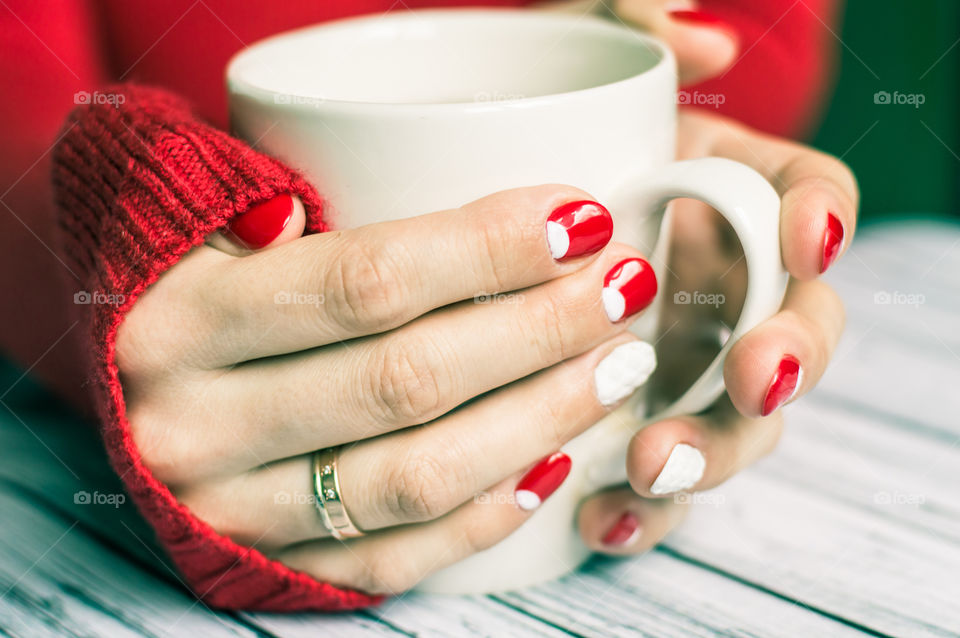 woman hand with cup of tea